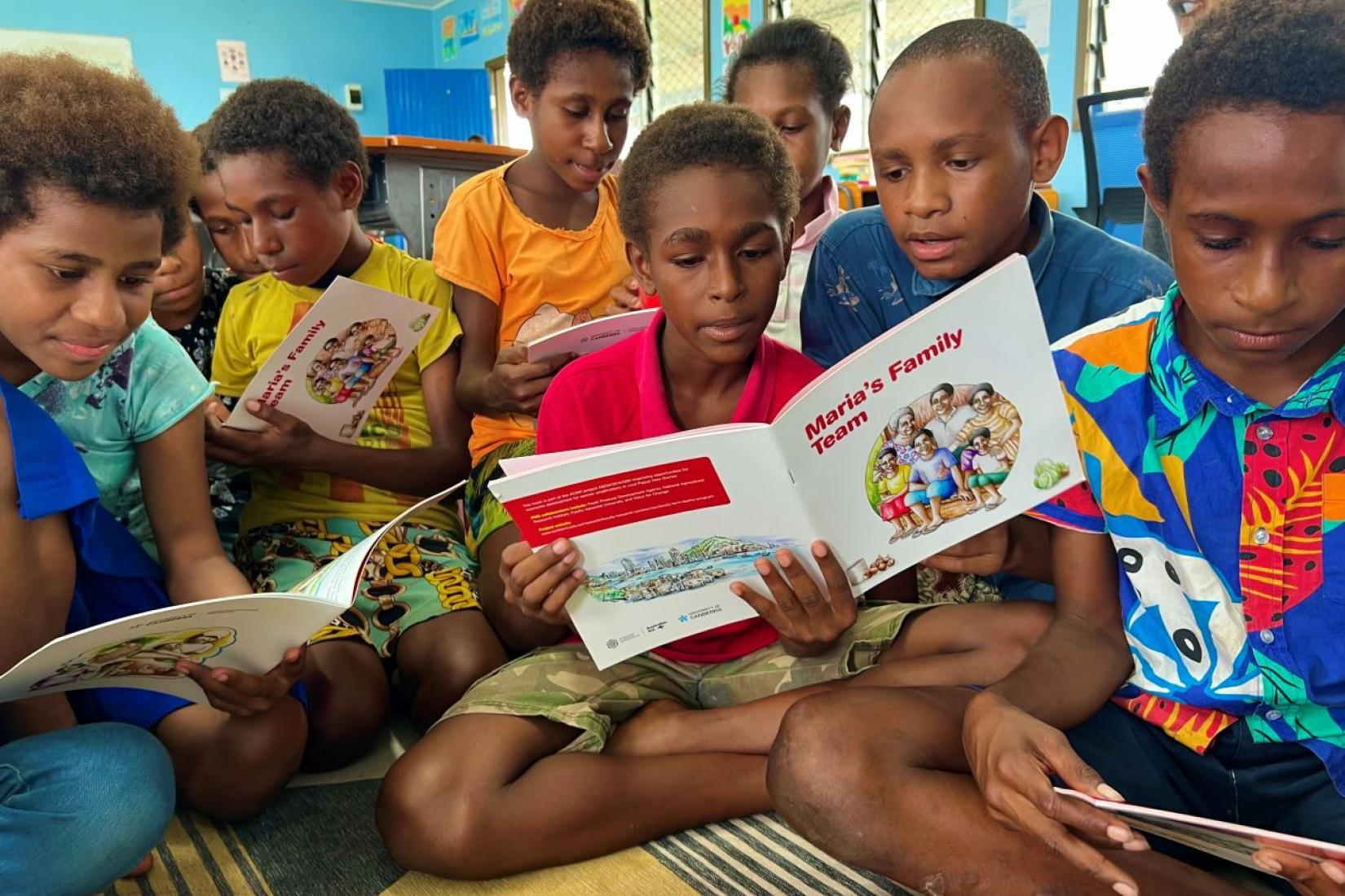Group of children reading books together