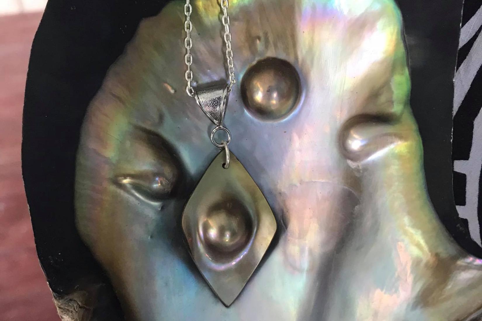 Mabe pearl necklace in an oyster shell