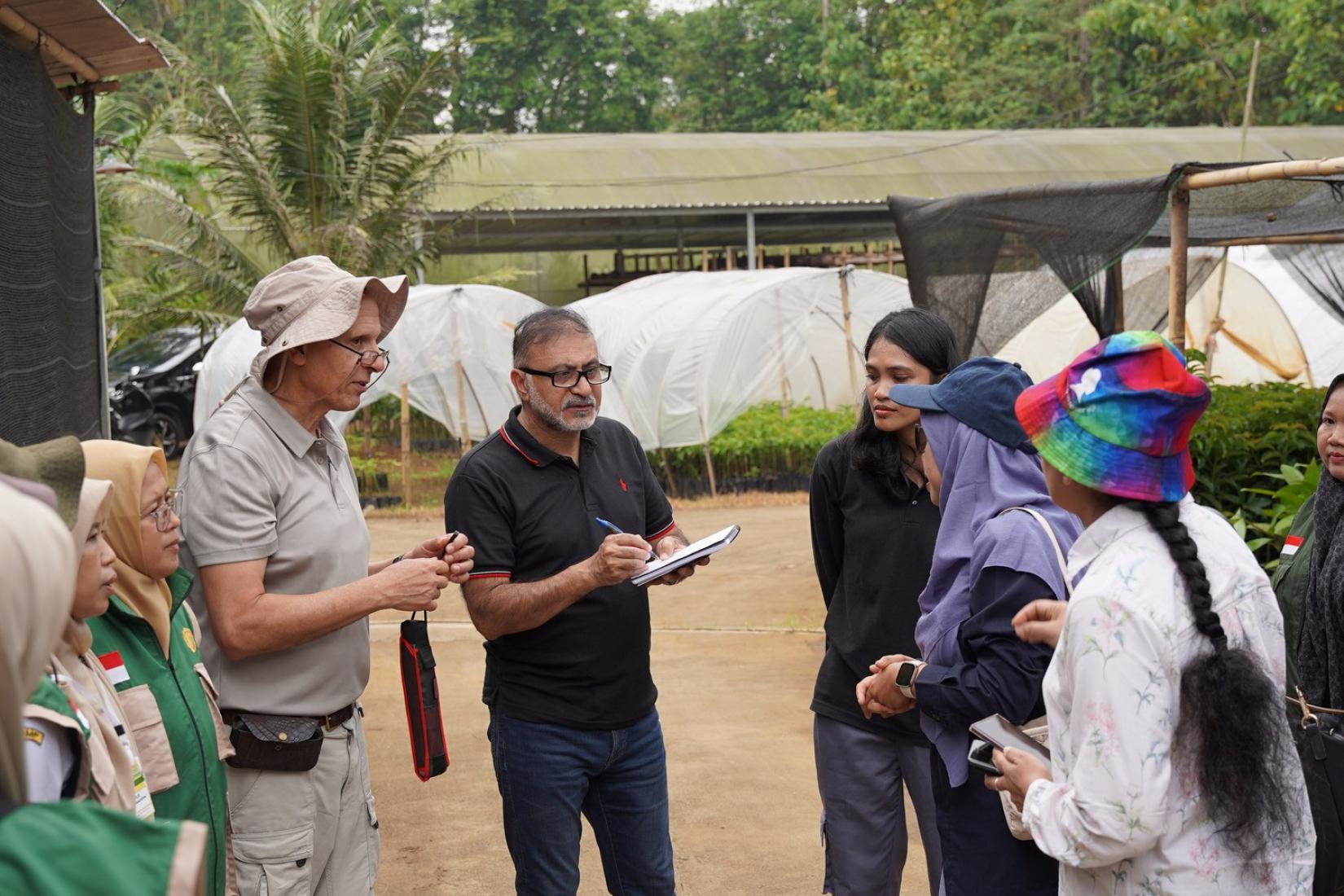 Project team in discussion during a field visit.