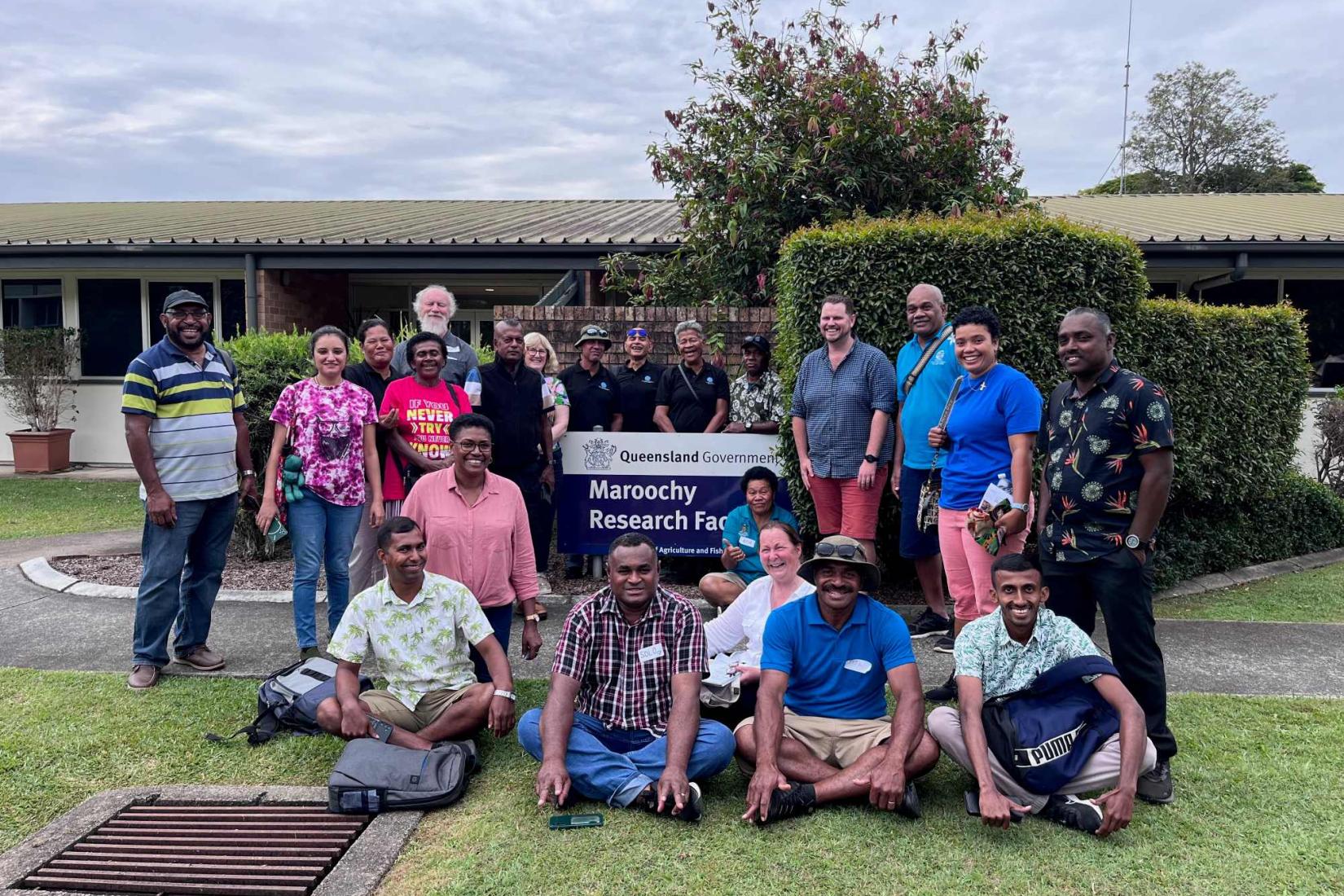 Group photo outside a research facility.