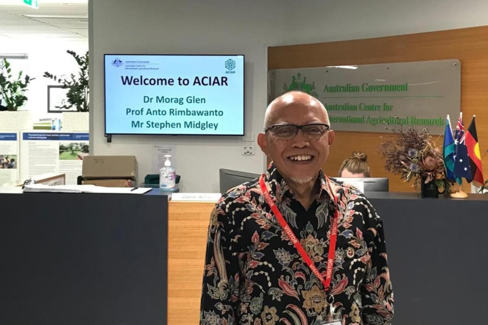 Visitor standing in the ACIAR reception area.