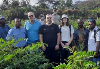 Group of researchers in coffee field 