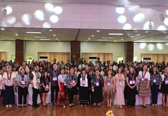 Large group participant photo in a conference hall