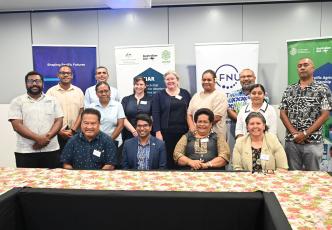 Participants and partners gathered for a group photo at a Pacific agricultural scholarship program event.
