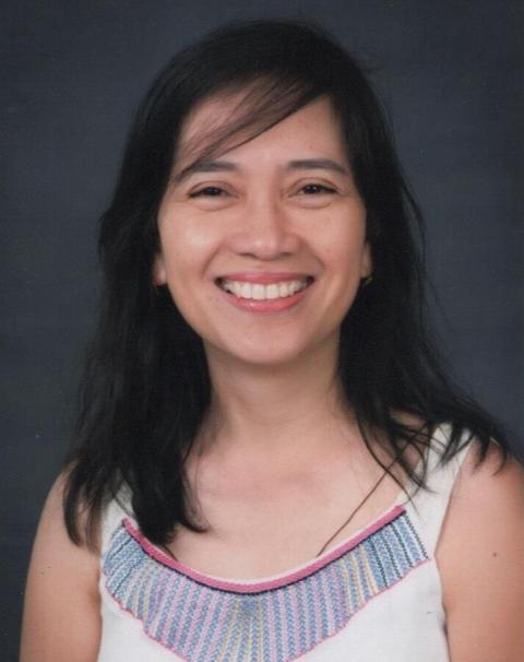 Headshot of a women smiling at the camera