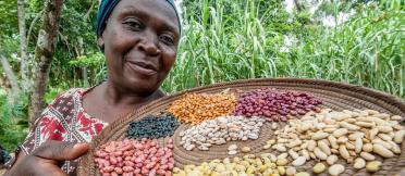 woman holding tray of assorted beans