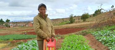 Woman standing in crop field