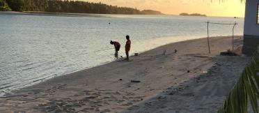 People standing at on river bank