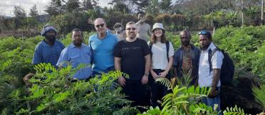 Group of researchers in coffee field 