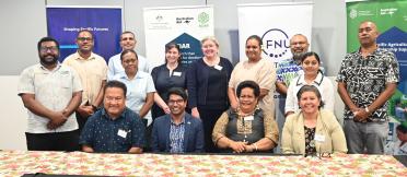 Participants and partners gathered for a group photo at a Pacific agricultural scholarship program event.