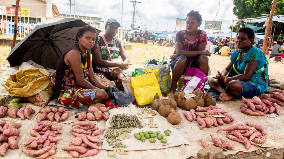 Women from Daru Island, in the South Fly District of Western Province, selling their goods at the Town market. 