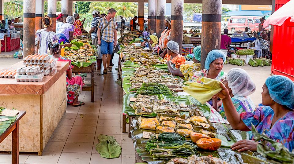 people at an undercover market in Vanuatu