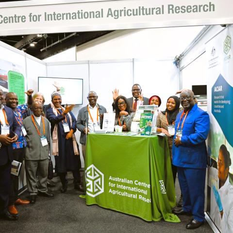 A group of people standing together at an exhibition booth