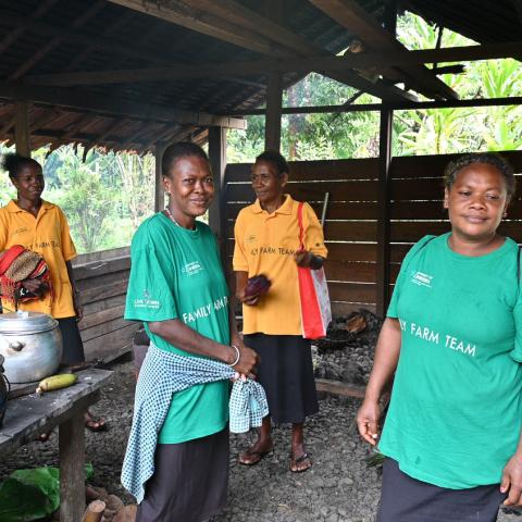 Village community educators smiling at the camera