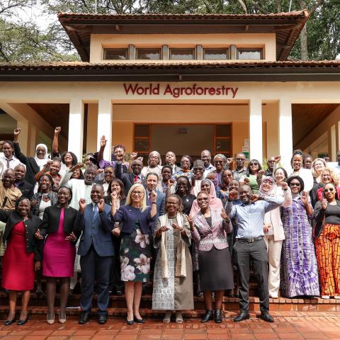 Group of participants celebrating outside the World Agroforestry building