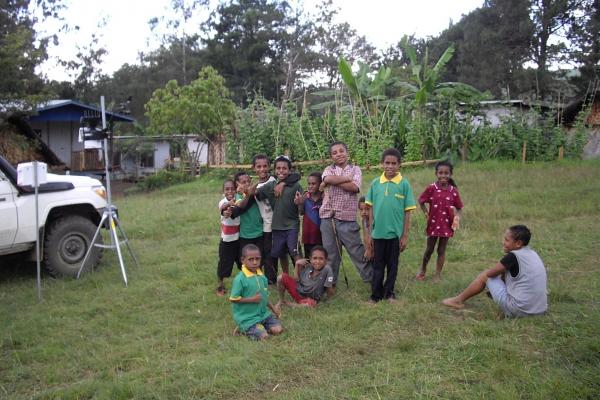 Highlands children with one of the weather stations. Credit: Dr Steven Crimp ANU