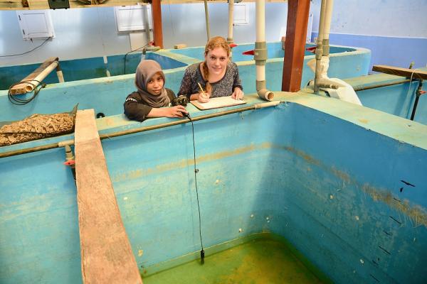 Siobhan (right) with Rosdiana (left) testing water quality for hatchling tank. Photo: Darren James, Scope Global