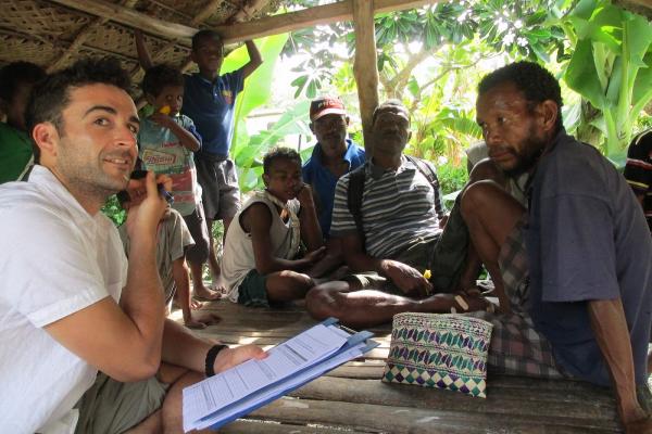 Simon Vieira conducting fisher survey questionnaires in the  Milne Bay Province. Photo: William White.