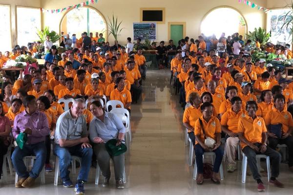 Barangay Farmer Technicians (BAFTechs in orange shirts) with (front row left) Jayne Curnow, Henry Binahon (President LFPI), Noel Vock &amp; Mary Johnson.