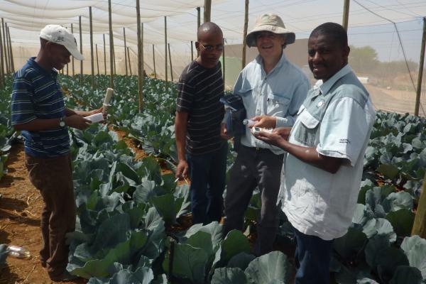 Dr Richard Stirzaker in the field with researchers in Africa