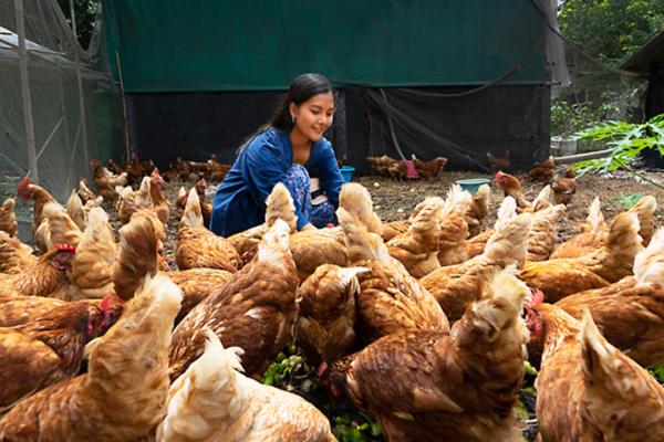 female farmer with chickens 