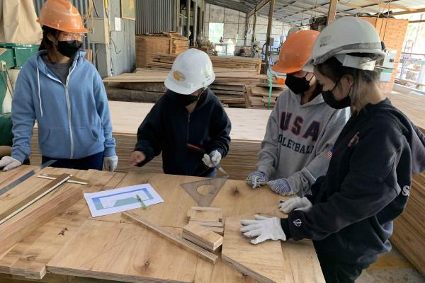 Students making adjustments to the bed design based on comments received from the faculty advisor.