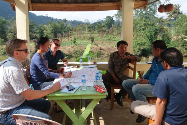 Dr Hilary Smith and project team talking to farmers about the impact of government policy on teak value chains (Nam Bak).