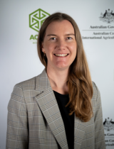 Headshot image of Zita Ritchie against an ACIAR banner background.