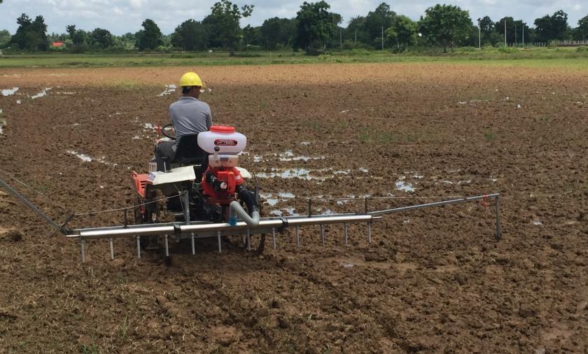 Cambodian farmers are adopting new technologies to help intensify and diversify their rice production systems to increase their returns: Eli Air seeder (modified on a Kubota transplanter tractor) being trialled at Don Bosco School Farm, Battambang for wet seeding and quality seed production. Photographer: Bob Martin