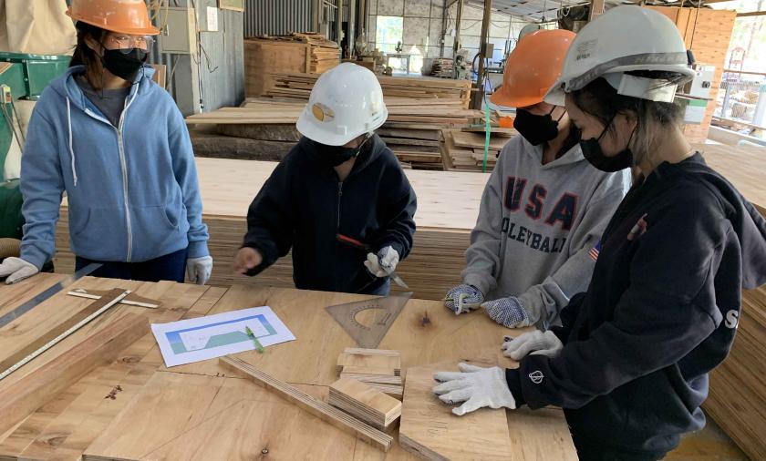 Students making adjustments to the bed design based on comments received from the faculty advisor.