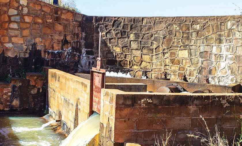 a rock wall as part of a water irrigation system