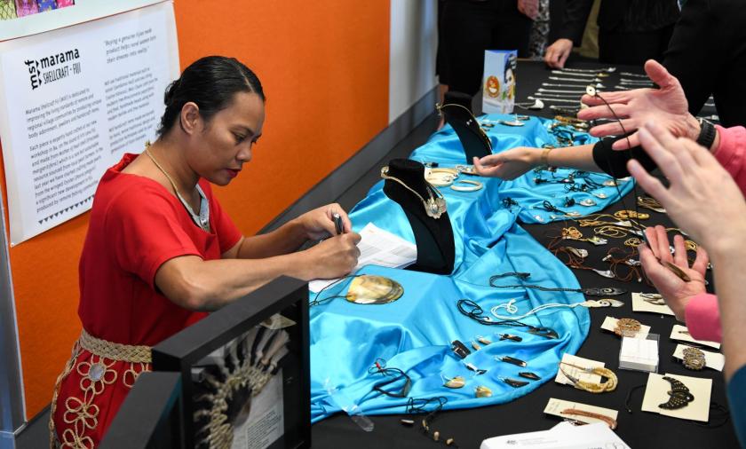 Women at a market stall with handicrafts