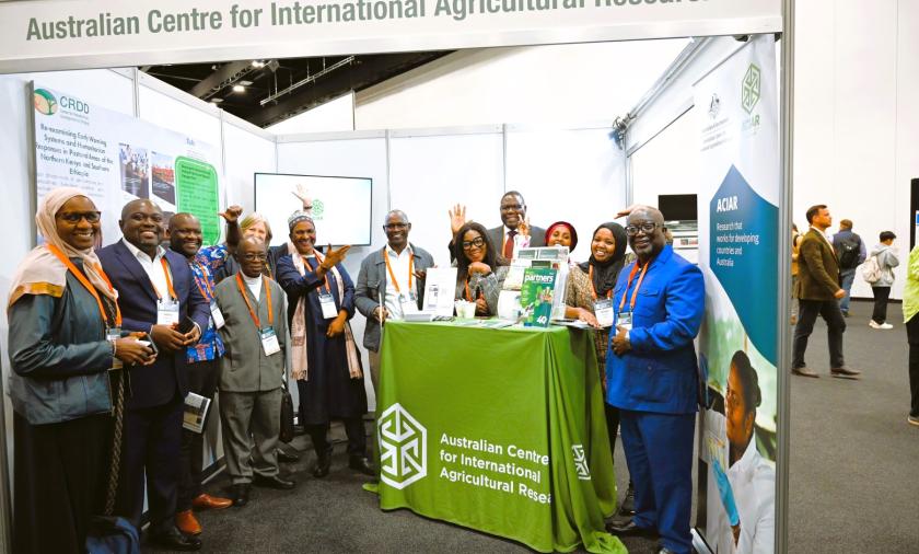 A group of people standing together at an exhibition booth