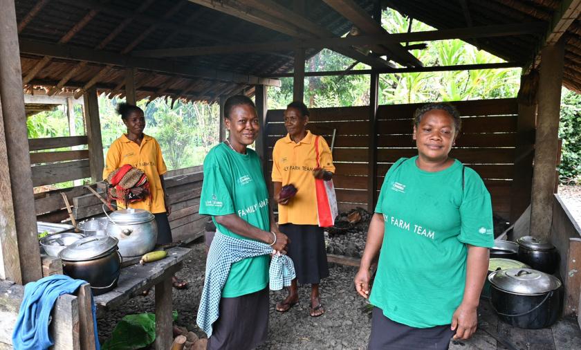 Village community educators smiling at the camera