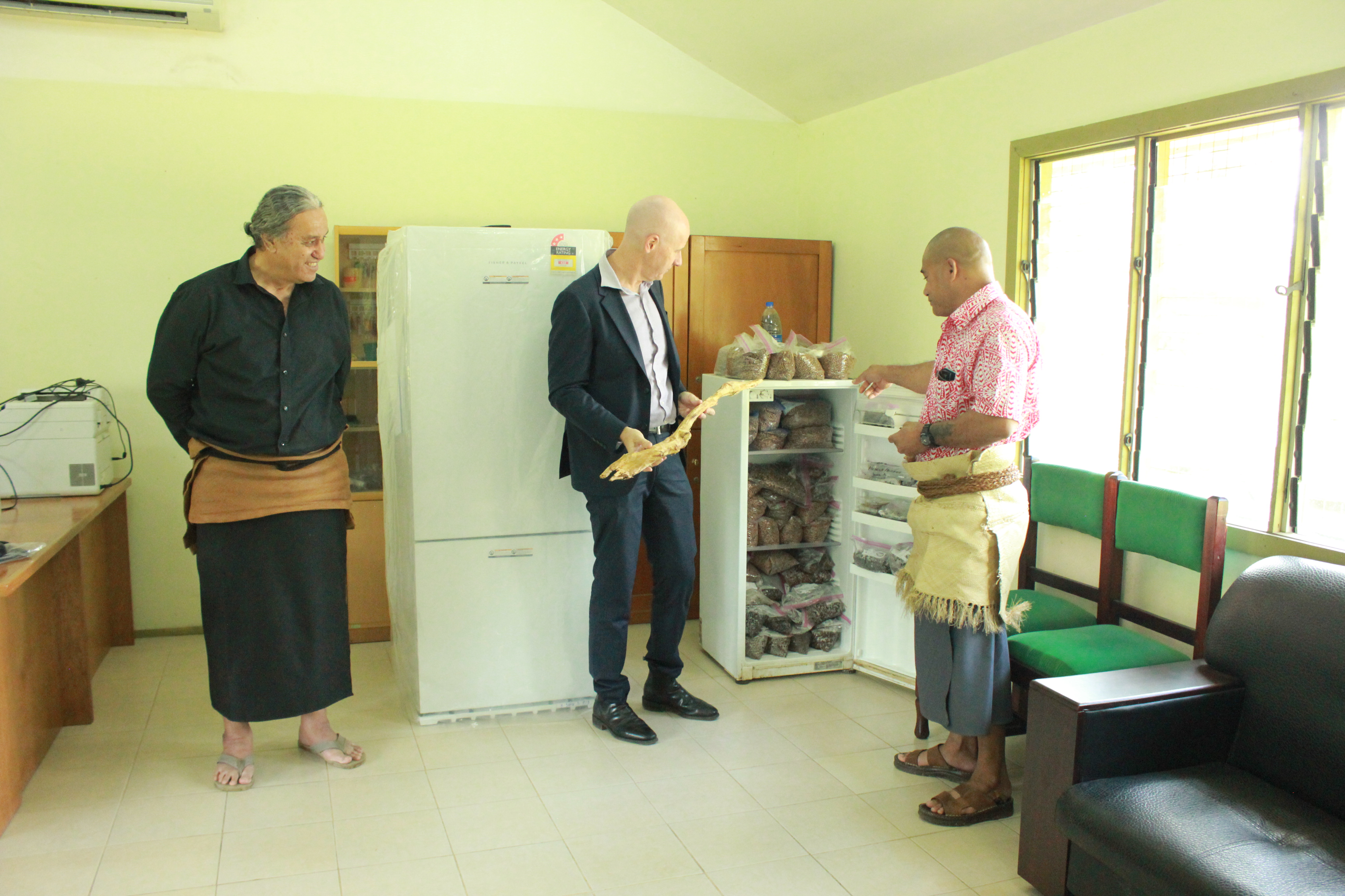 The Deputy High Commissioner to Tonga, Mr Nicholas Murphy (Second from right)  at the handover of the ACIAR funded seed storage refrigerator to the Tonga  Ministry of Agriculture, Food and Fisheries, CEO Dr Viliami Manu (second from left) in Nuku'
